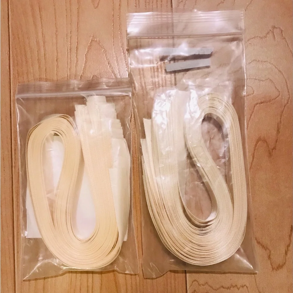 68 pieces of cream colored precut ribbon